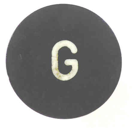 BUTTON, BLACK, MARKED G, 1 DIAMETER OTIS # 323BD1-G