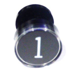 BUTTON, CLEAR CAP, 1 DIAMETER, MARKED #1 OTIS # A323BD1-1