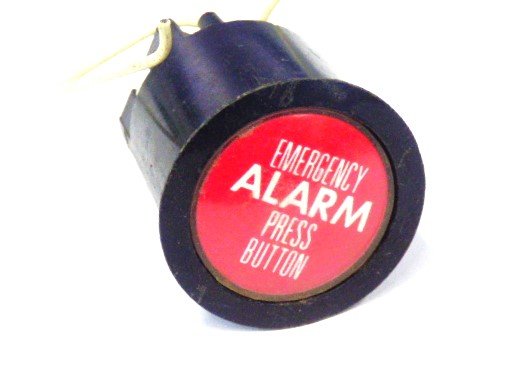 PUSHBUTTON, BLACK, ROUND, RED INSERT, MARKED EMER. ALARM  US # 167-03011-100